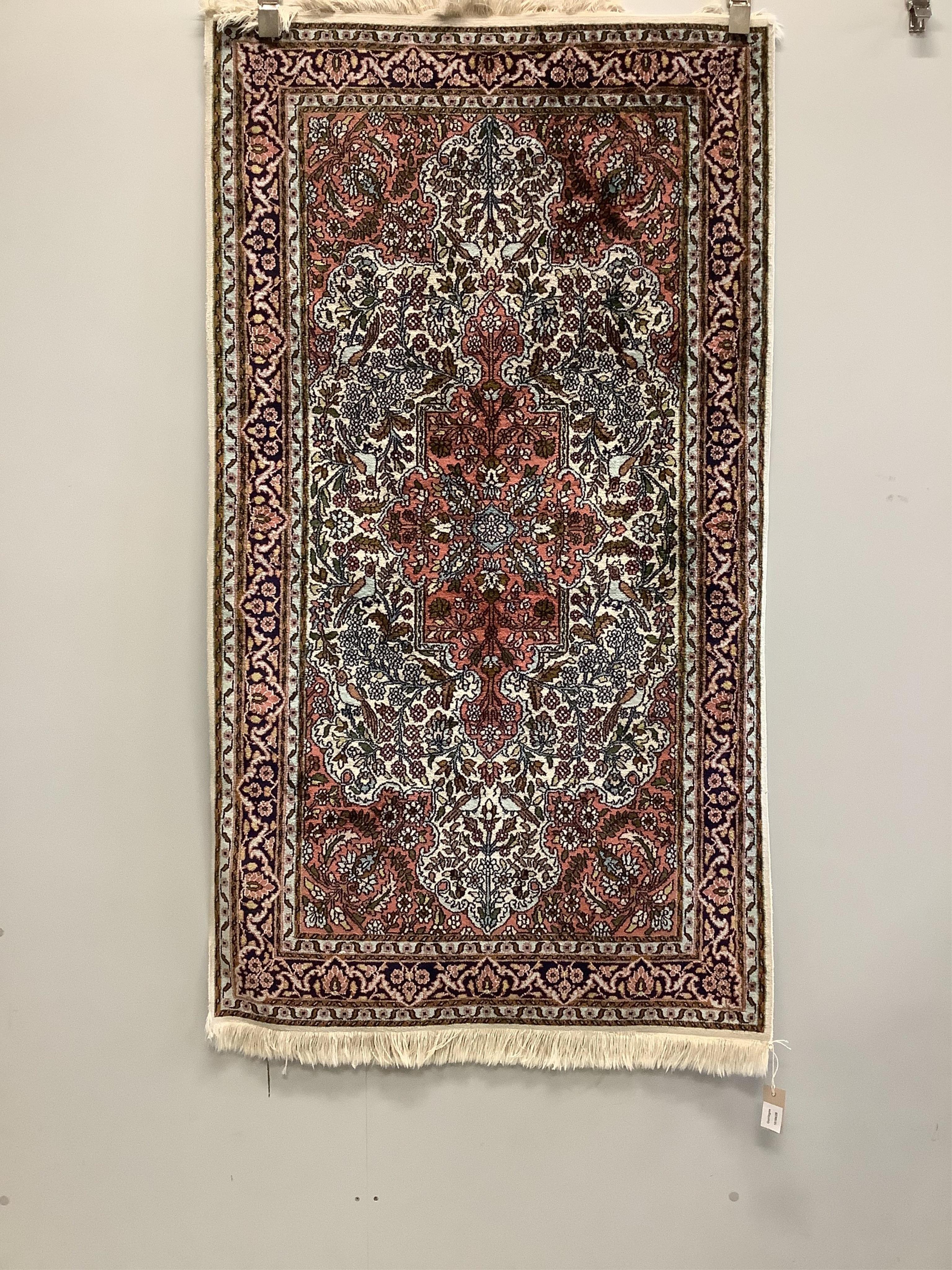 A North West Persian ivory ground rug, 160 x 90cm. Condition - good